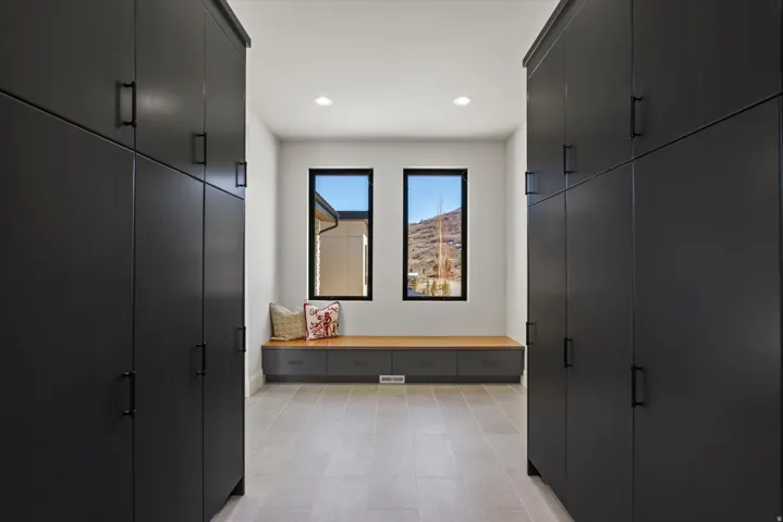 Mudroom with recessed lighting and light flooring