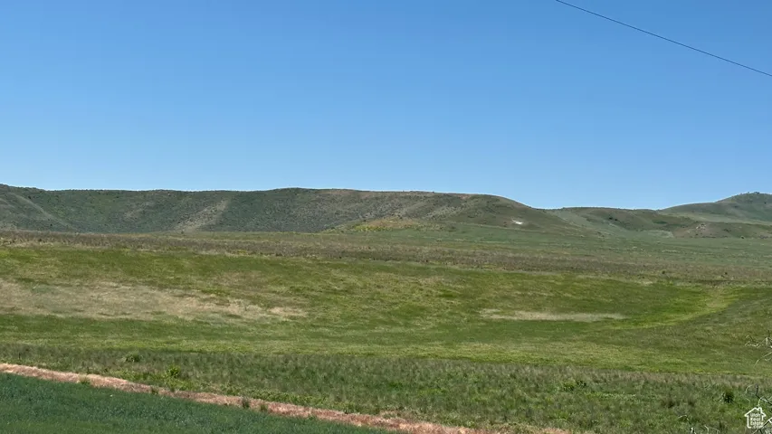 View of mountain background featuring rural landscape