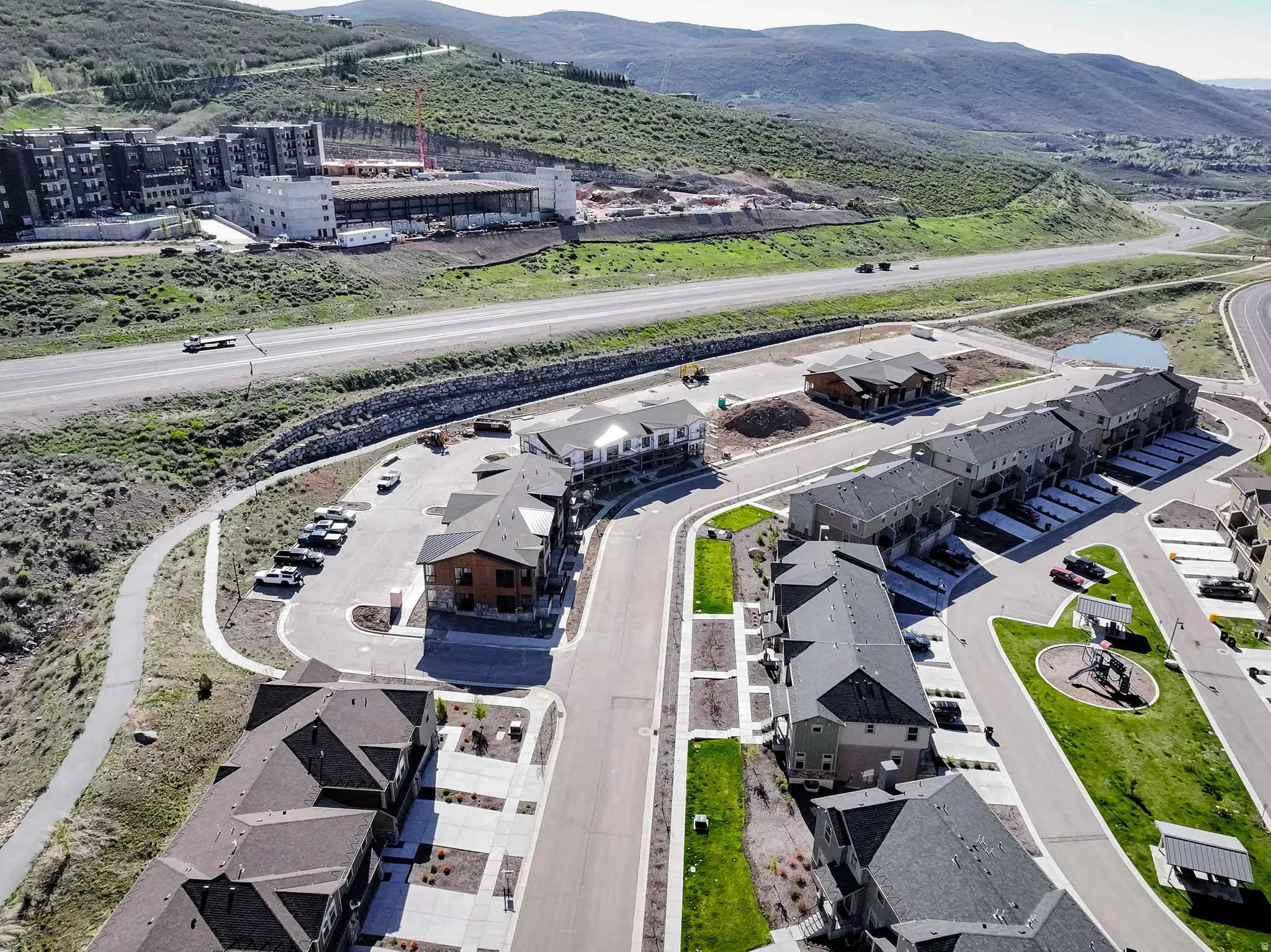 Aerial view of property and surrounding area with a mountainous background