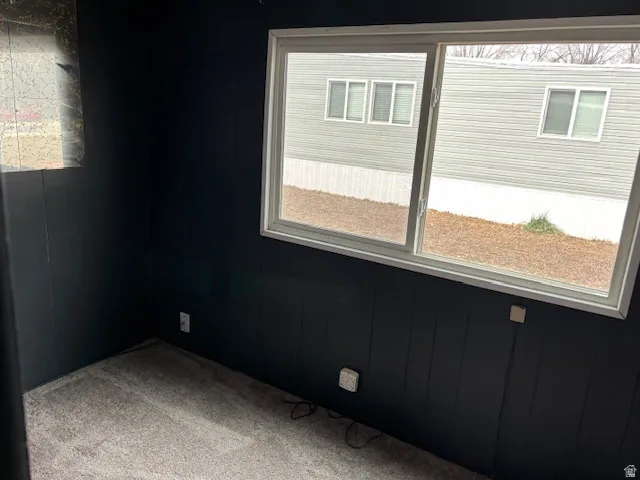 Spare room with light colored carpet