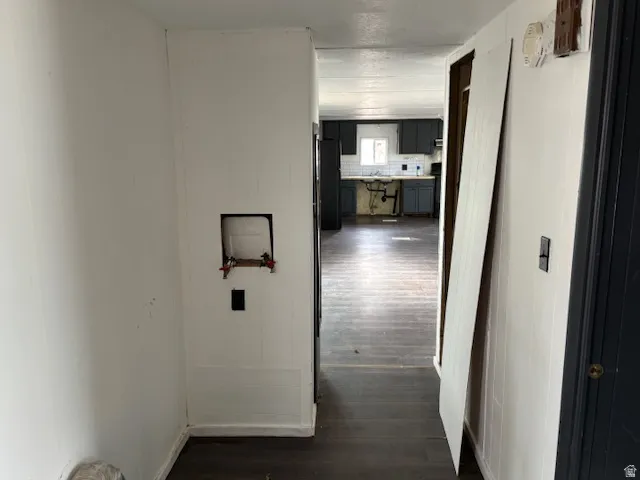 Hallway featuring dark wood-type flooring