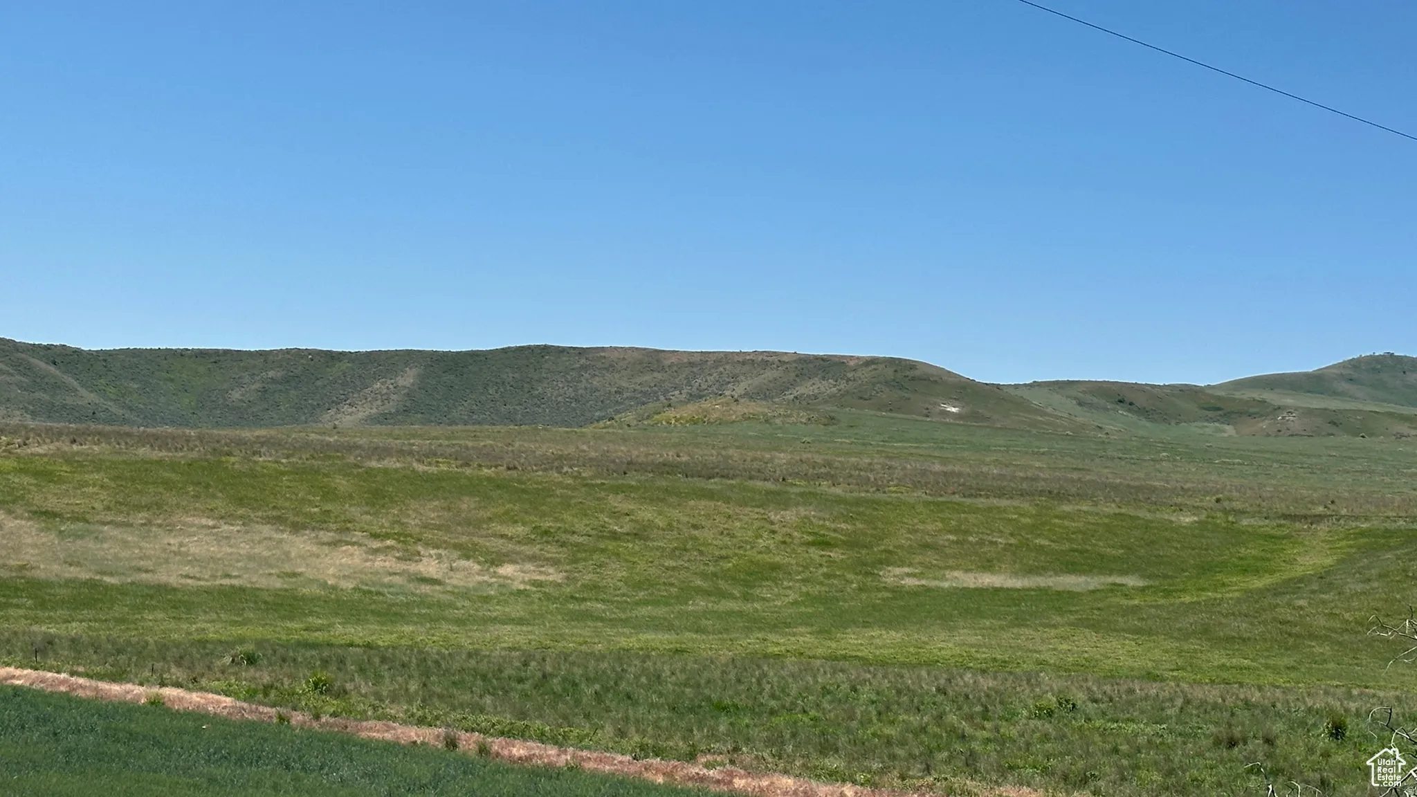 View of mountain background featuring rural landscape