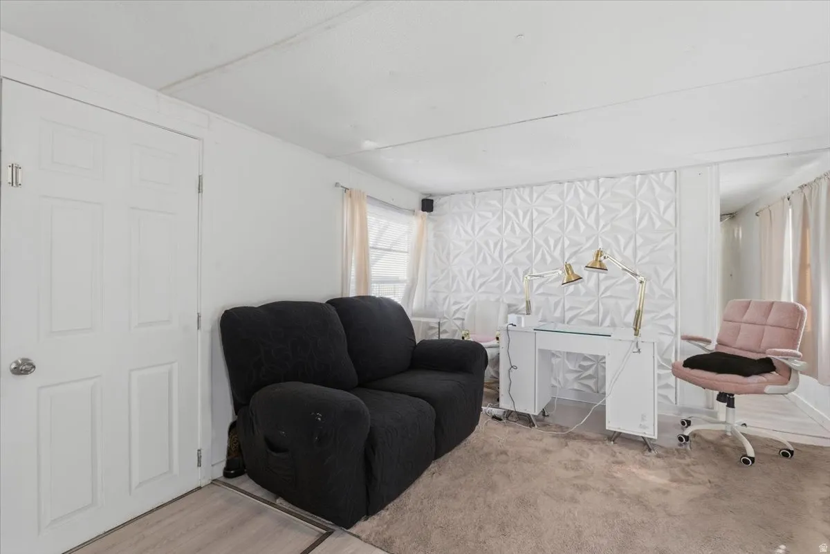 Sitting room with carpet flooring