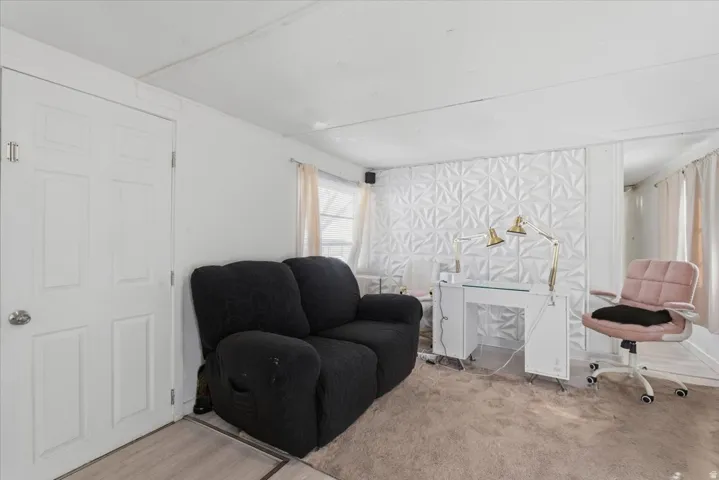 Sitting room with carpet flooring