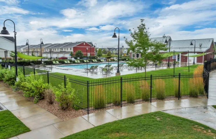 Surrounding community featuring a swimming pool, a residential view, and a patio
