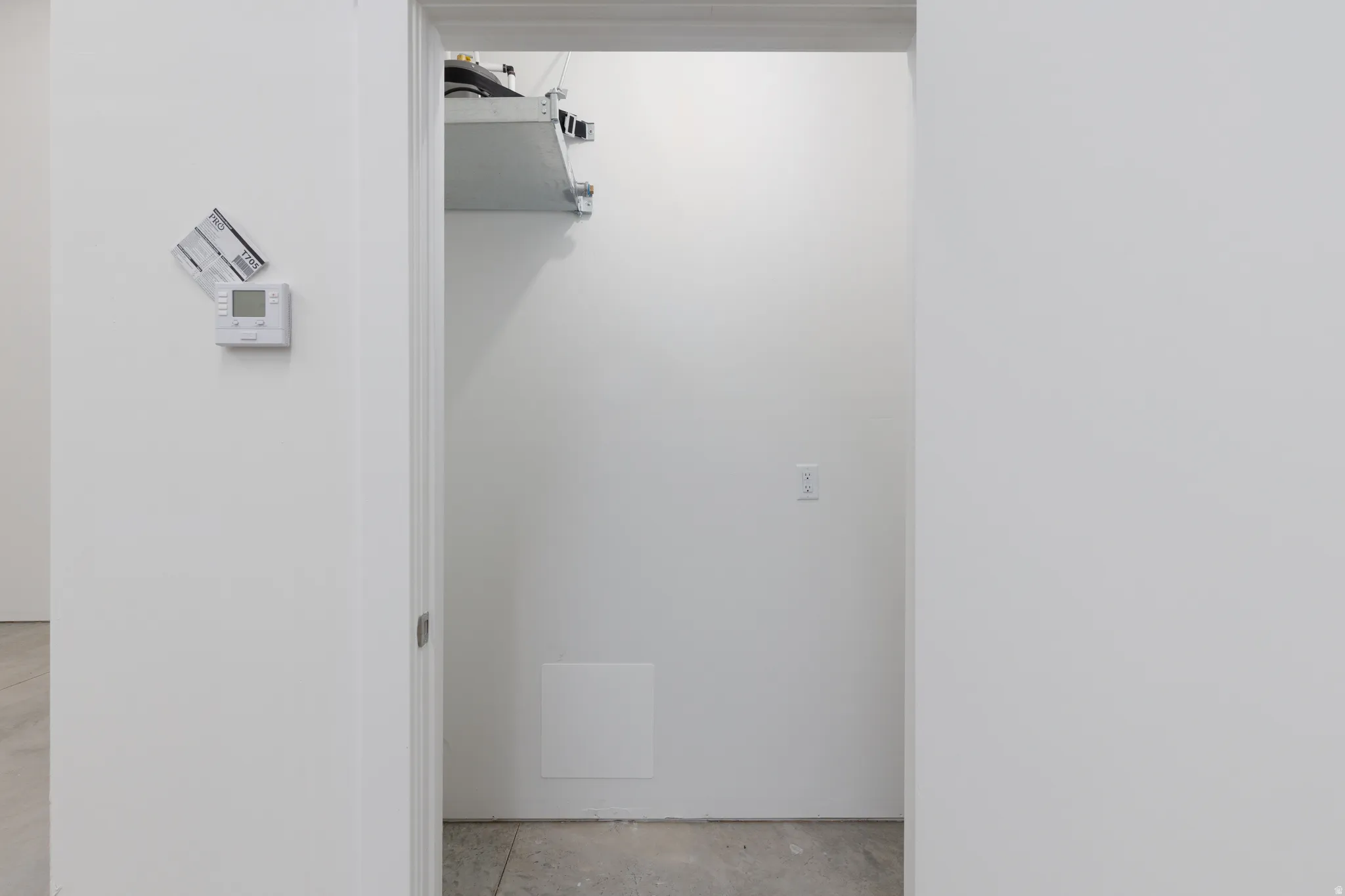Bathroom with unfinished concrete flooring