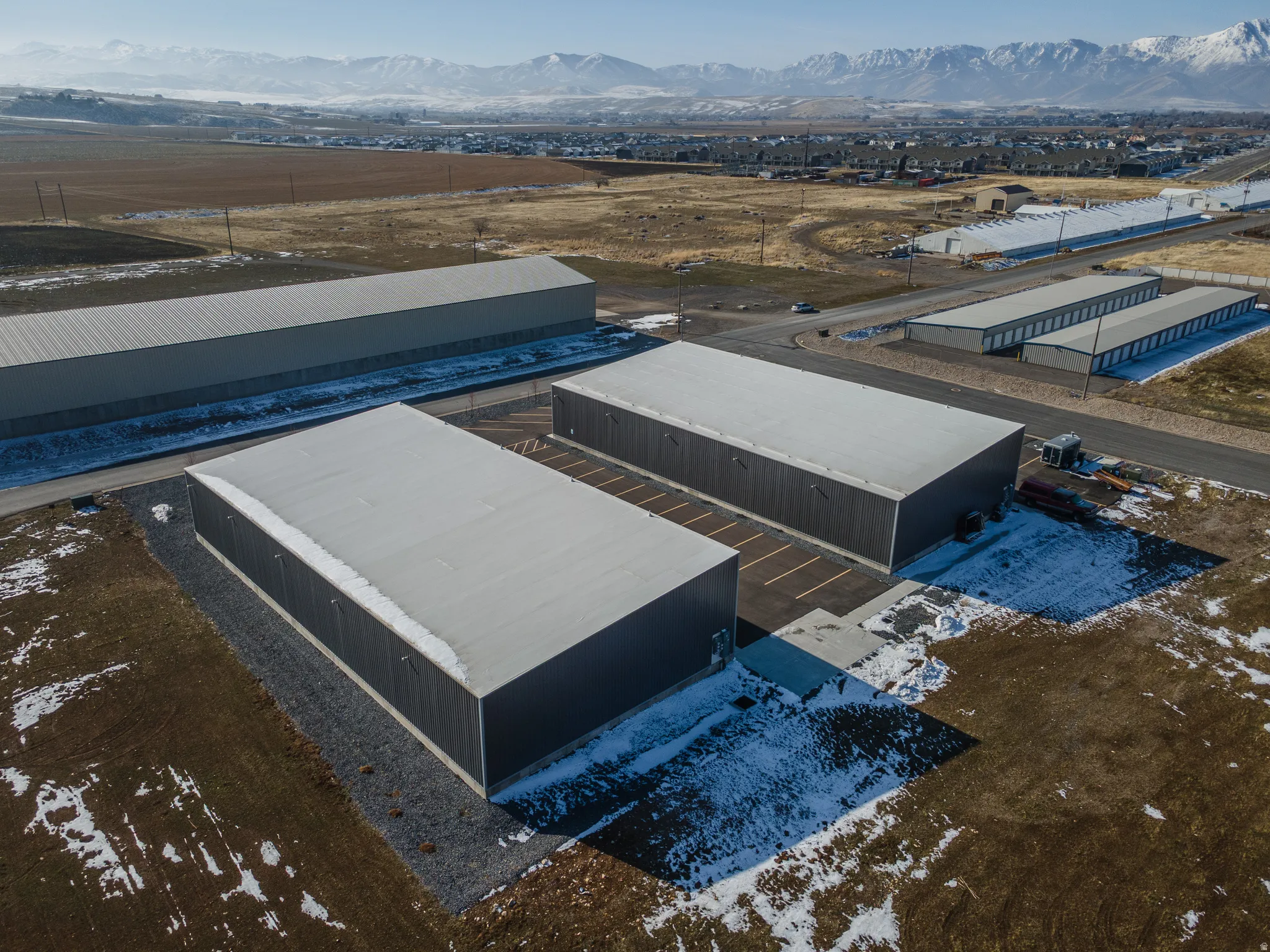 Drone / aerial view of an industrial area and mountains