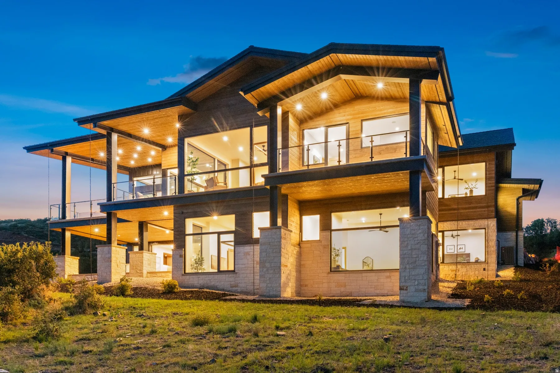 Multi-level residence featuring extensive wood siding and stone accents