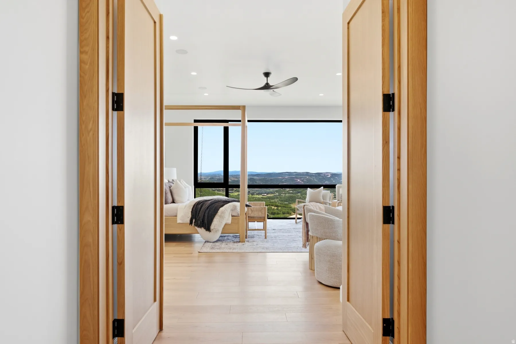 Wide plank wood-finish flooring extends throughout this expansive interior space