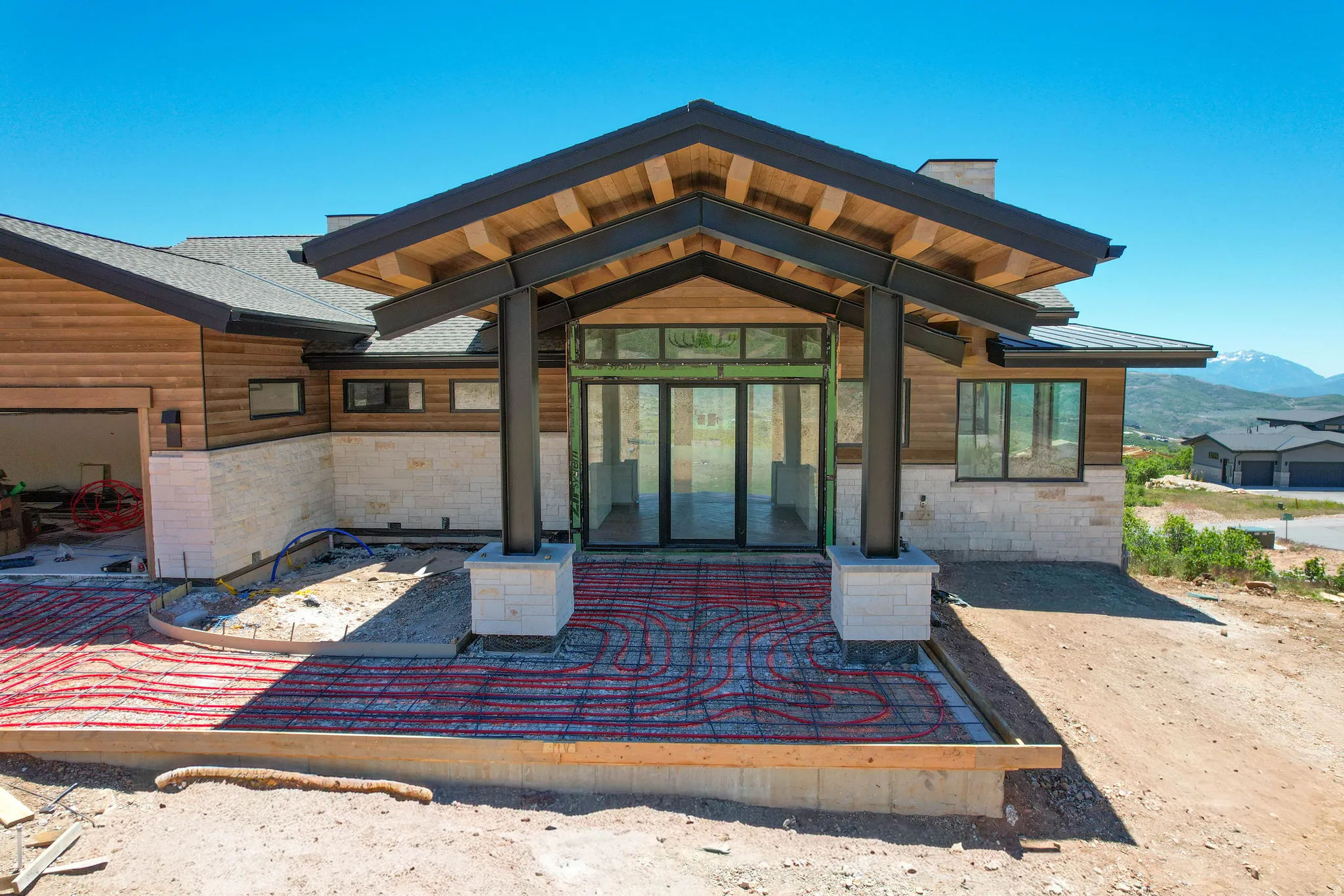 Contemporary architectural design featuring a wood-clad and stone exterior