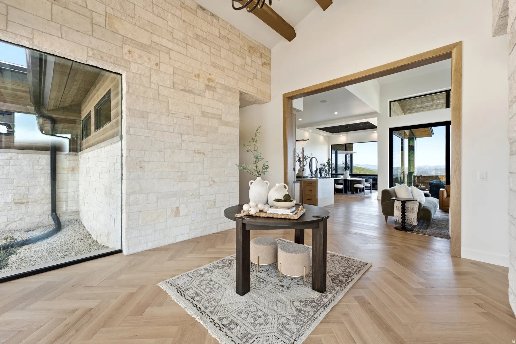 Herringbone wood-finish flooring with a light natural tone