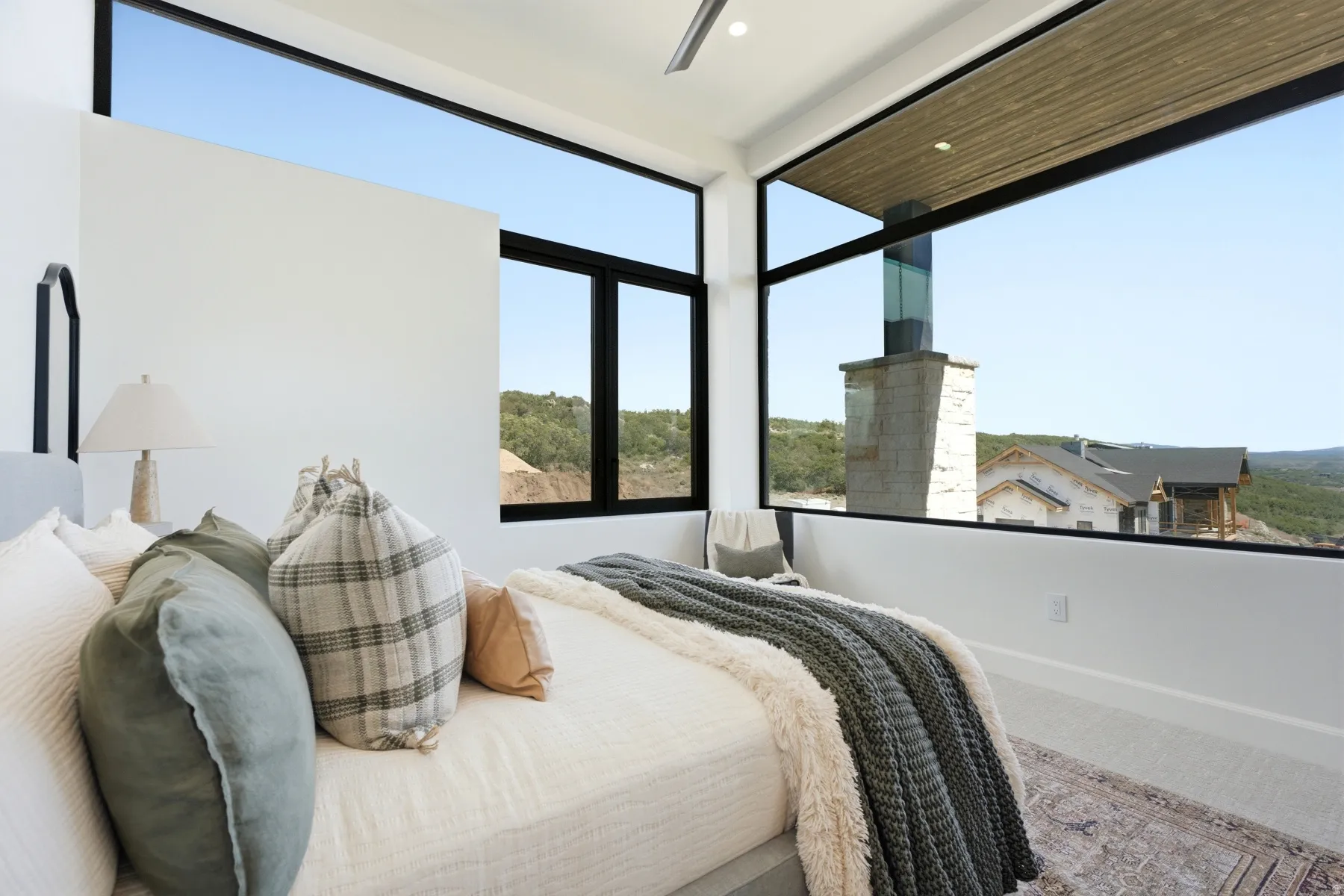 Expansive floor-to-ceiling windows with black framing