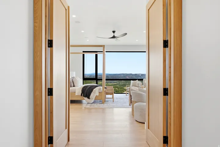 Wide plank wood-finish flooring extends throughout this expansive interior space