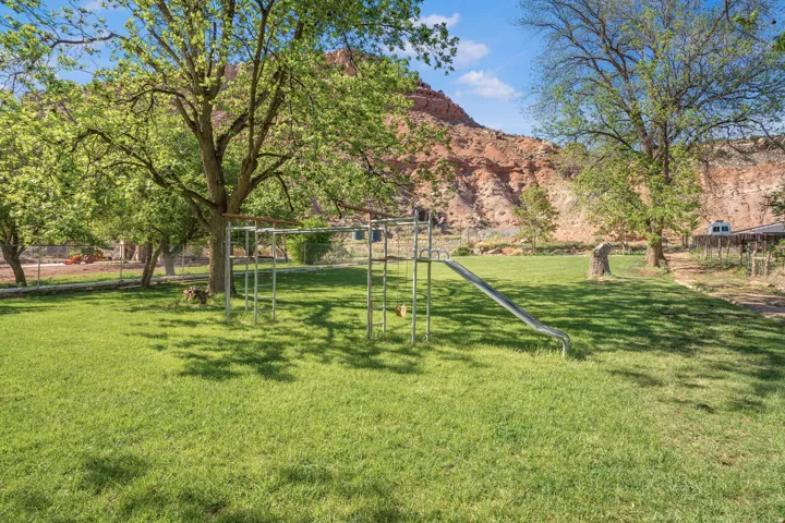 View of yard with a playground and a mountain view