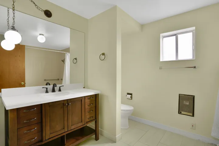 Full bath with vanity, a shower with curtain, and light tile patterned flooring