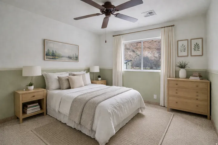 Bedroom featuring light carpet and a ceiling fan