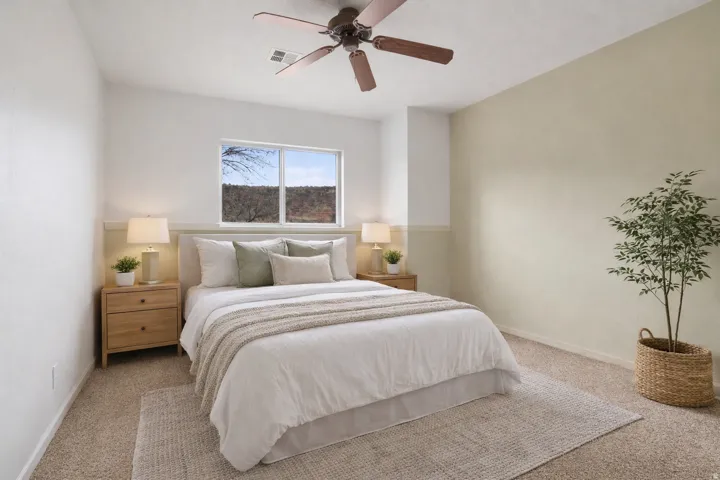 Bedroom featuring carpet floors and a ceiling fan