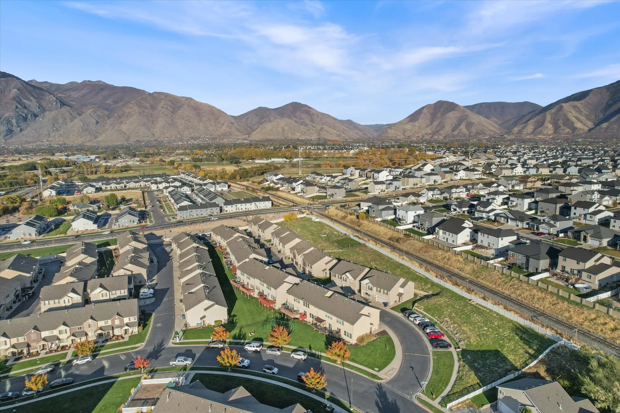 Aerial view of residential area featuring a mountainous background