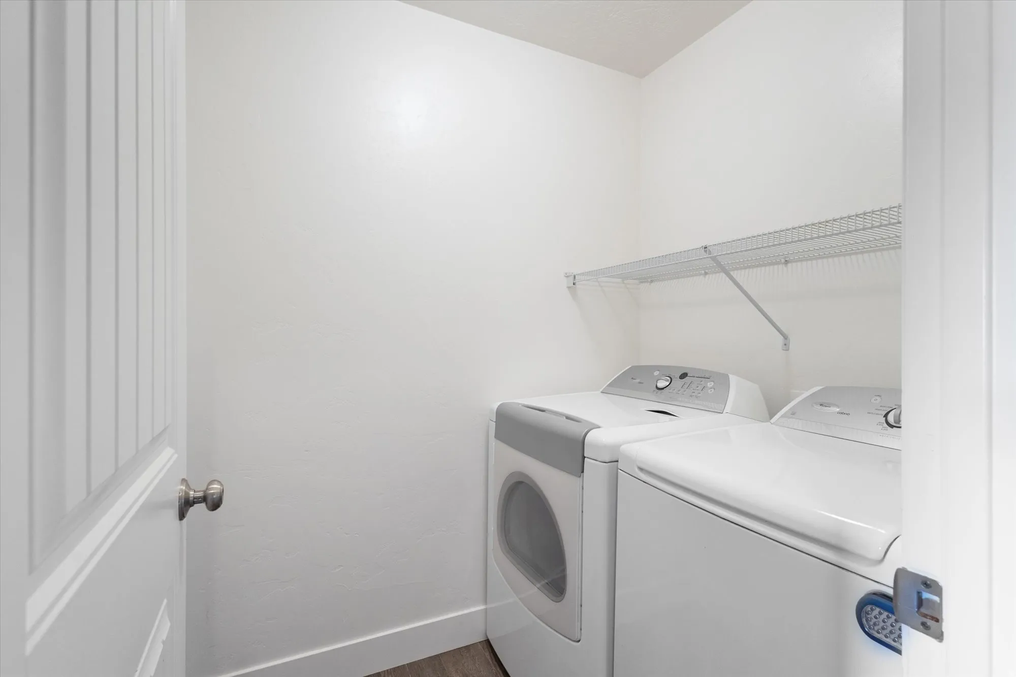 Washroom featuring independent washer and dryer and dark wood-style floors