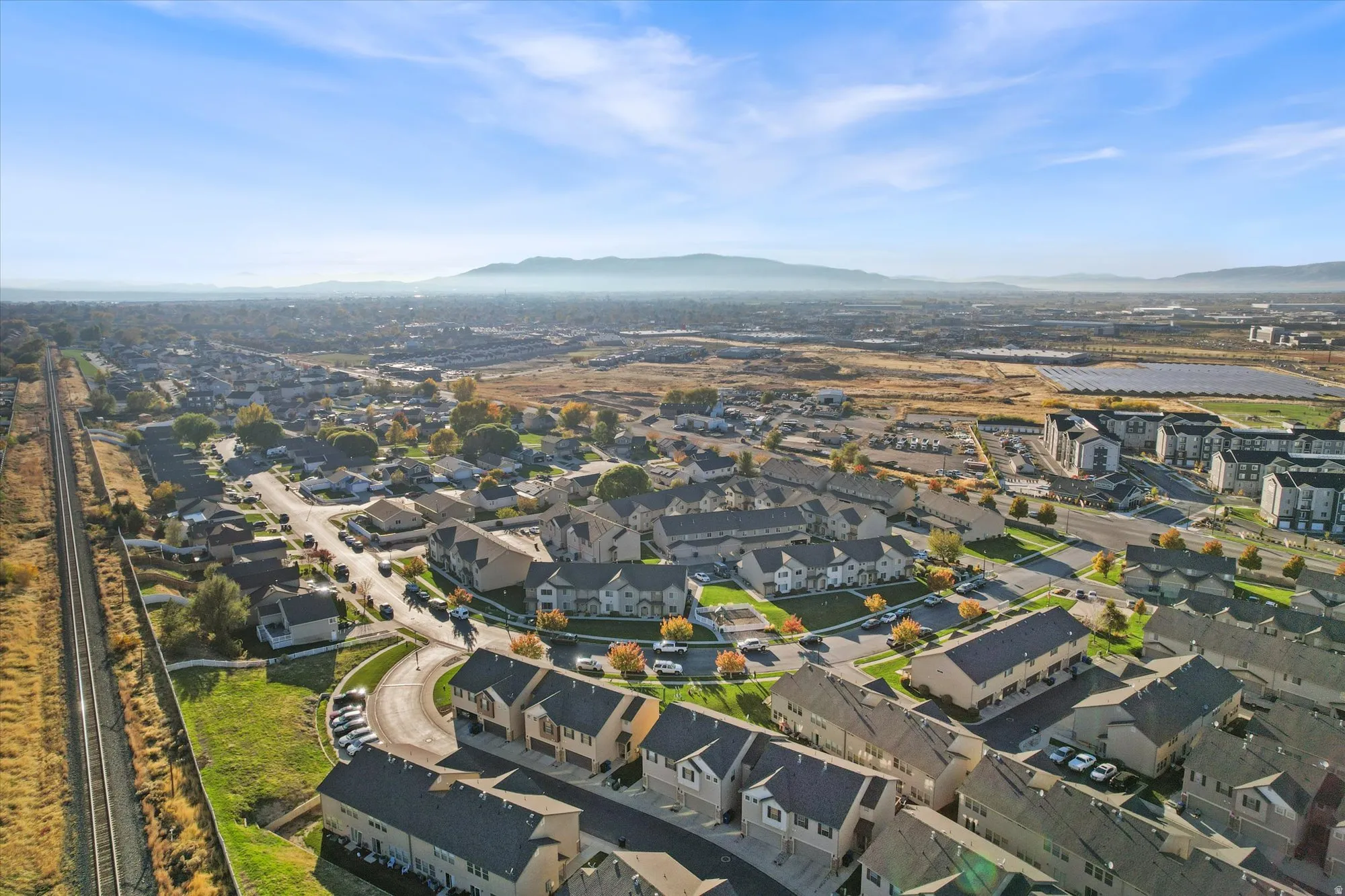 Aerial view of residential area featuring a mountain backdrop