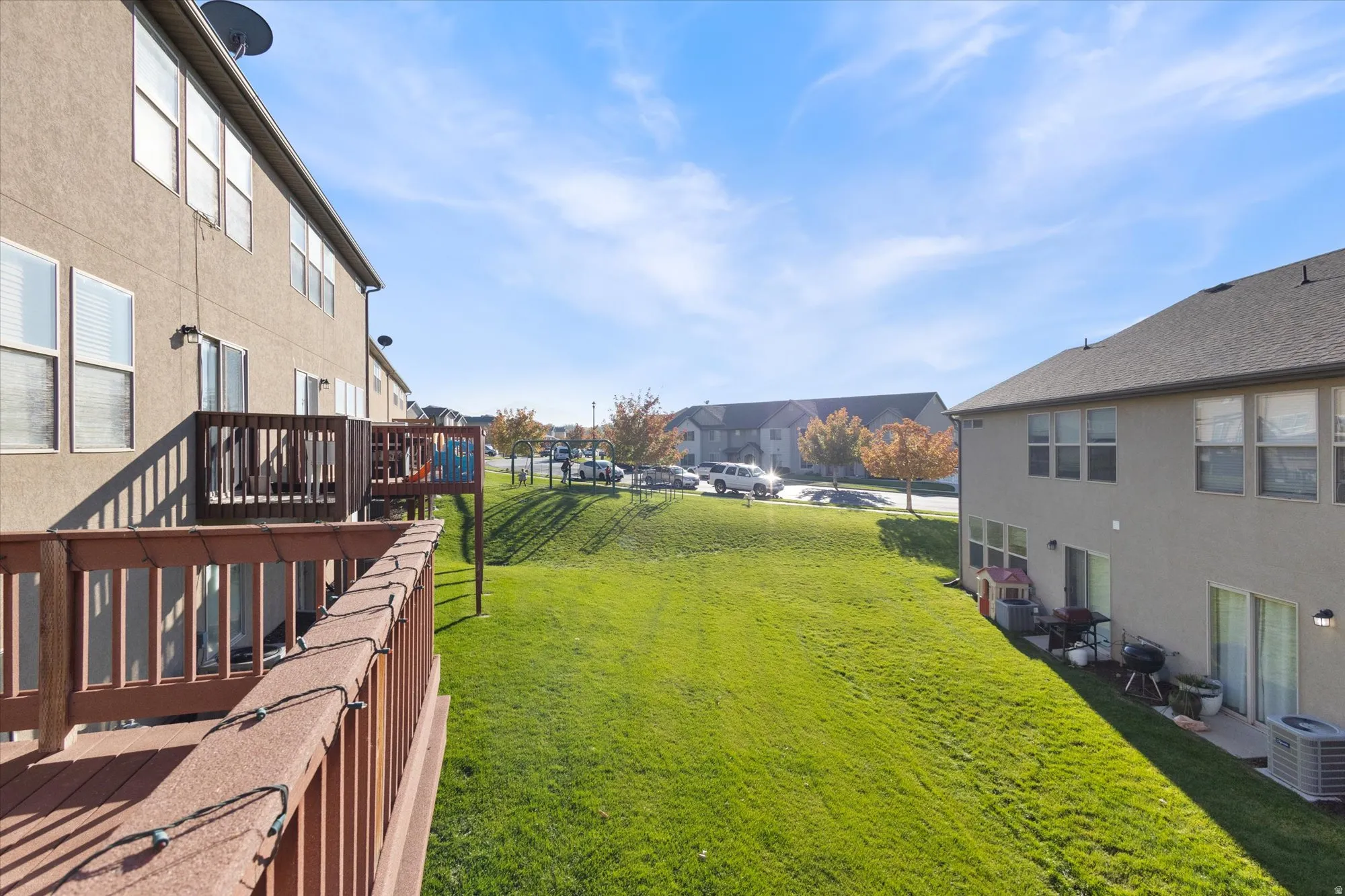View of green lawn featuring a residential view