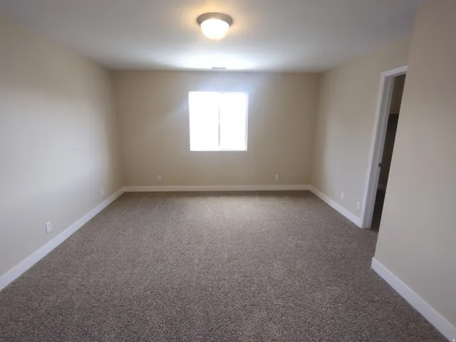 Spare room with carpet flooring and baseboards