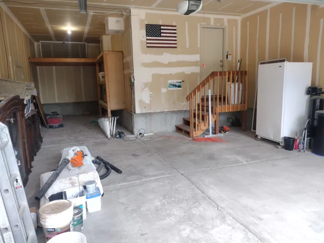 Garage featuring a double deep stall on the left