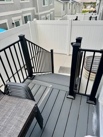 Wooden terrace with a residential view. Filly fence