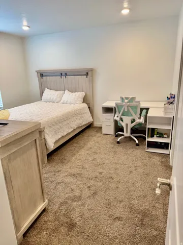 Bedroom with light carpet and recessed lighting.nice view, private in-suite and walk in closet