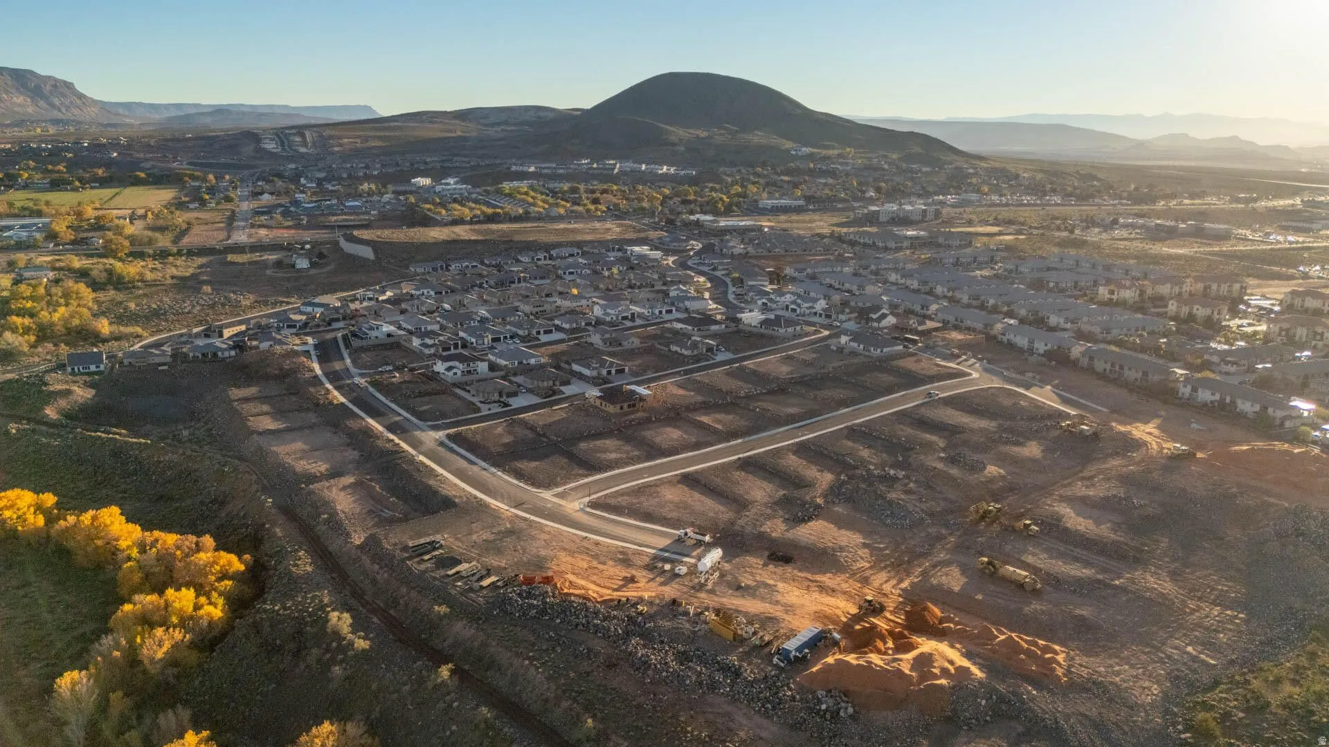 Aerial view of property's location featuring mountains and nearby suburban area