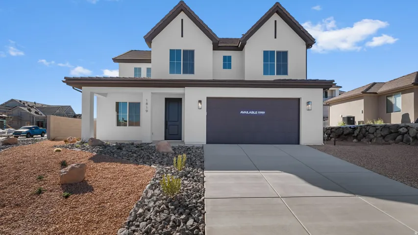 View of front facade with a porch, stucco siding, concrete driveway, and an attached garage