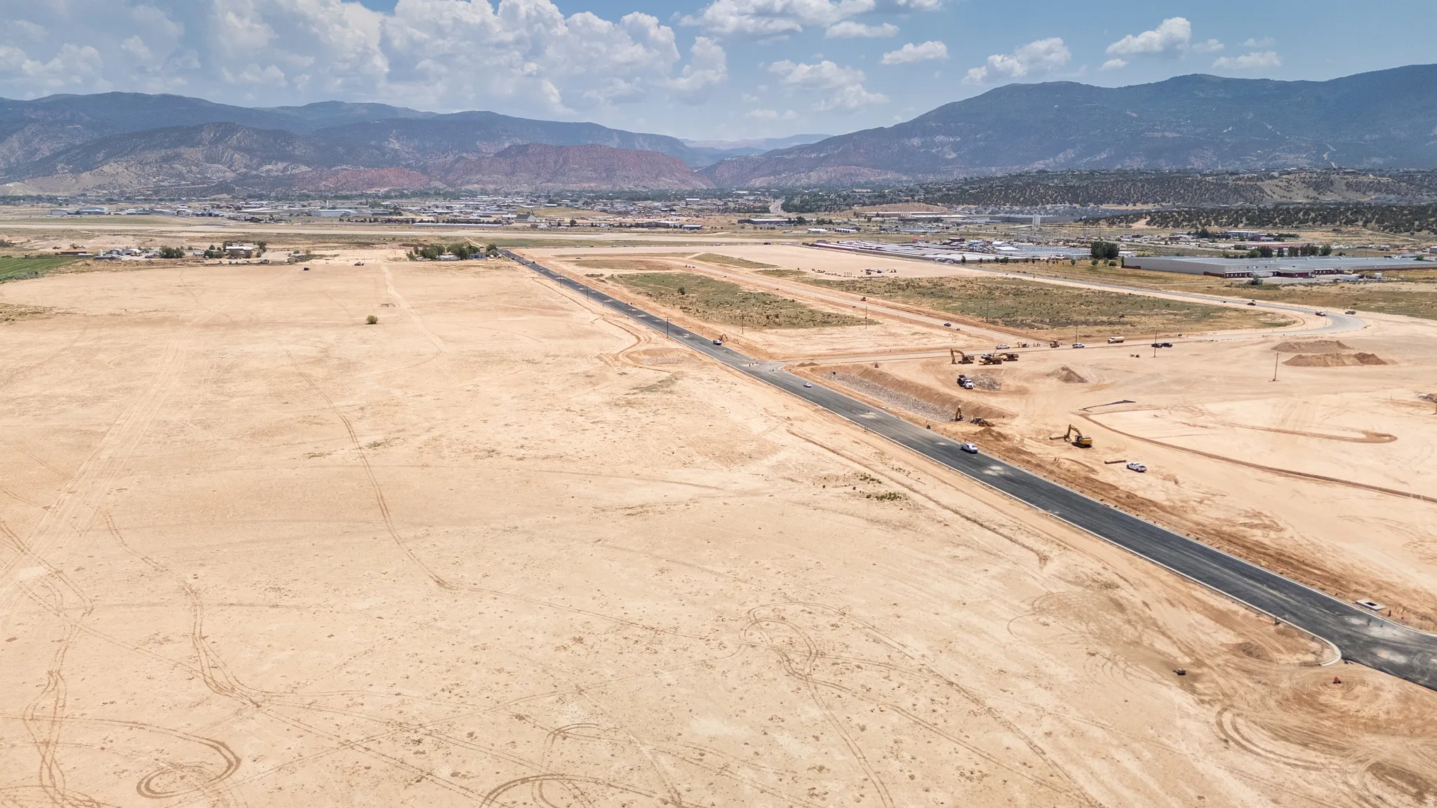 Overview of rural landscape with a mountainous background and a desert landscape