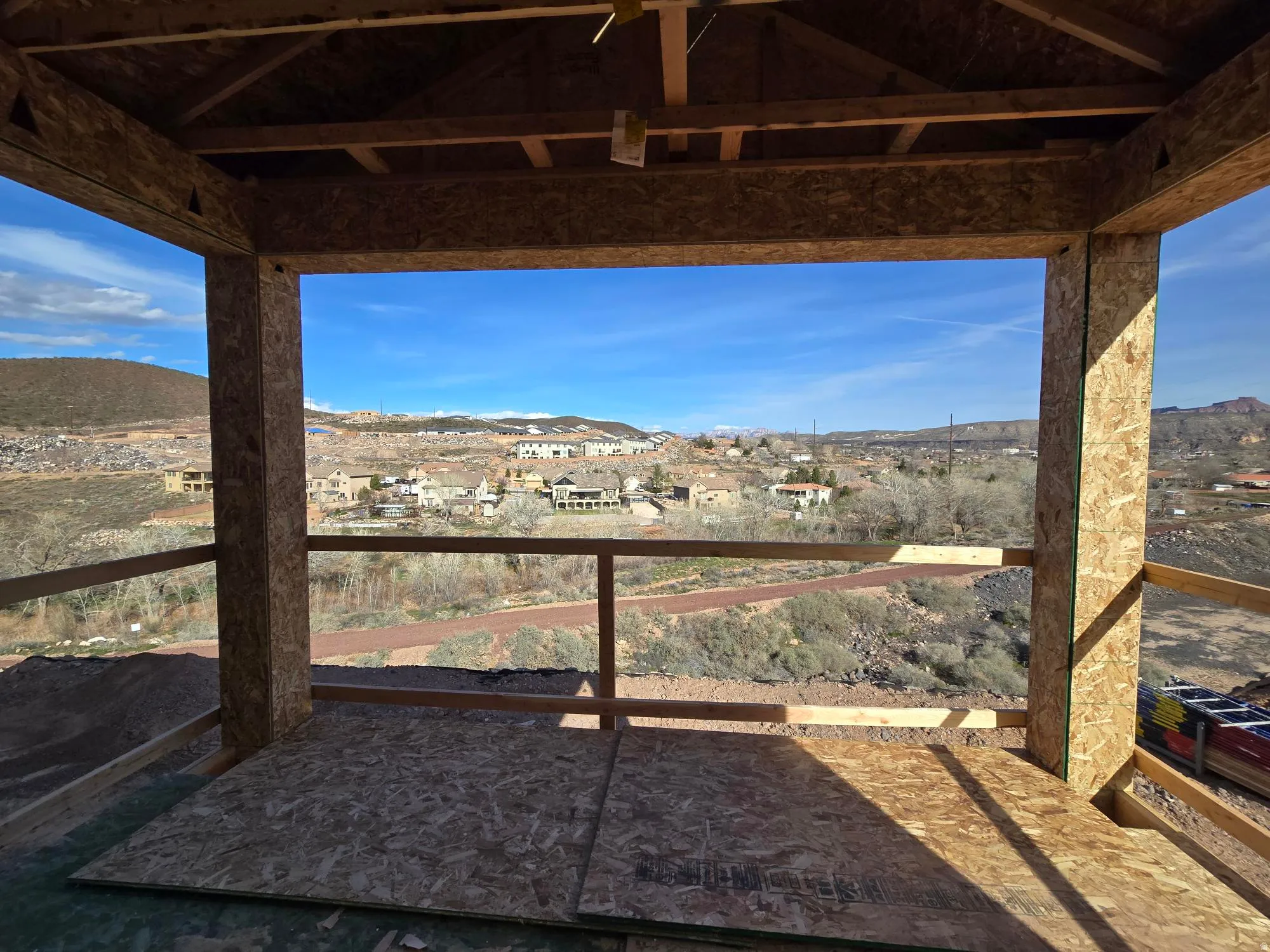 View of yard featuring a mountain view, a balcony, and a residential view