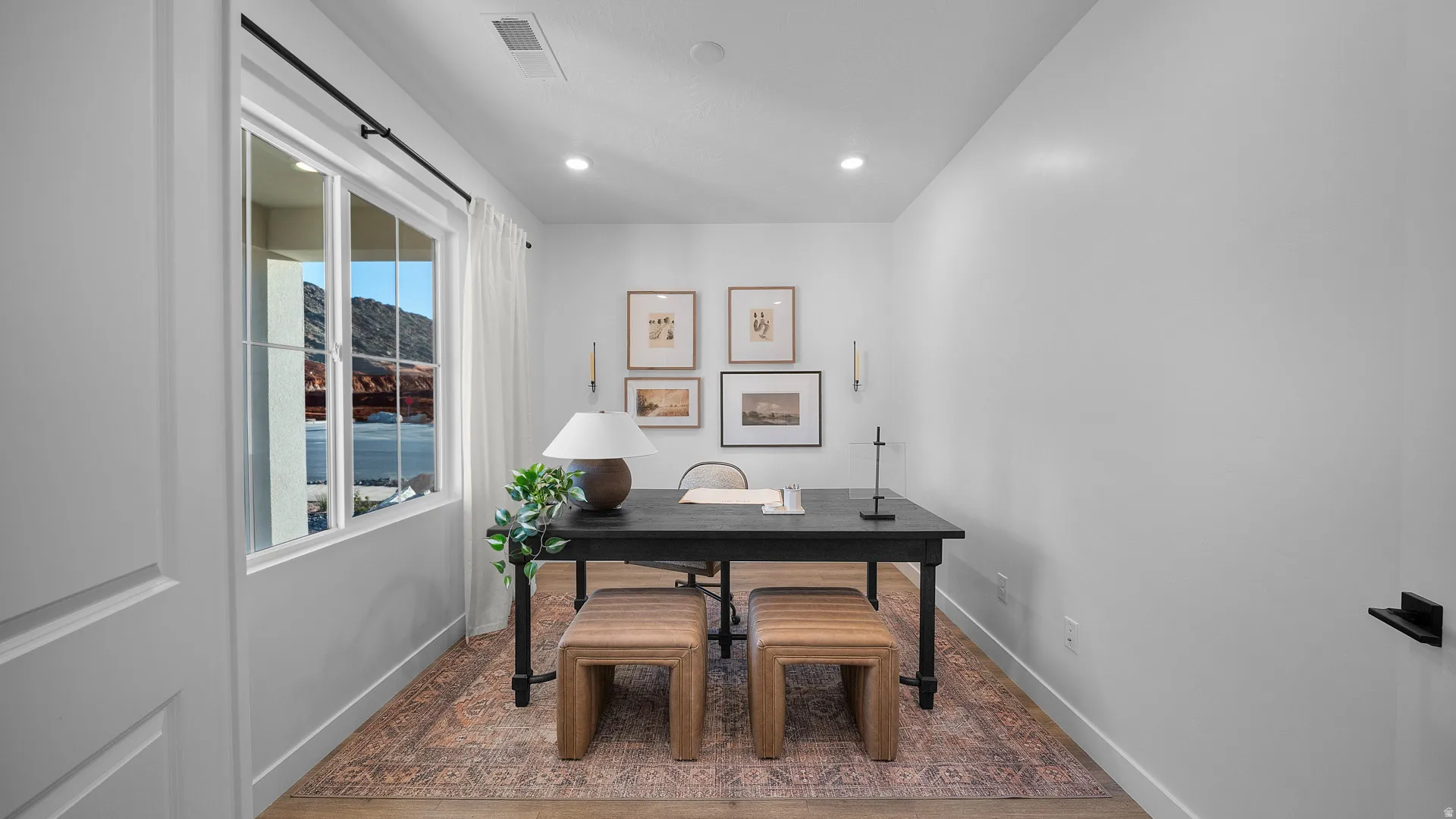 Office with baseboards and recessed lighting