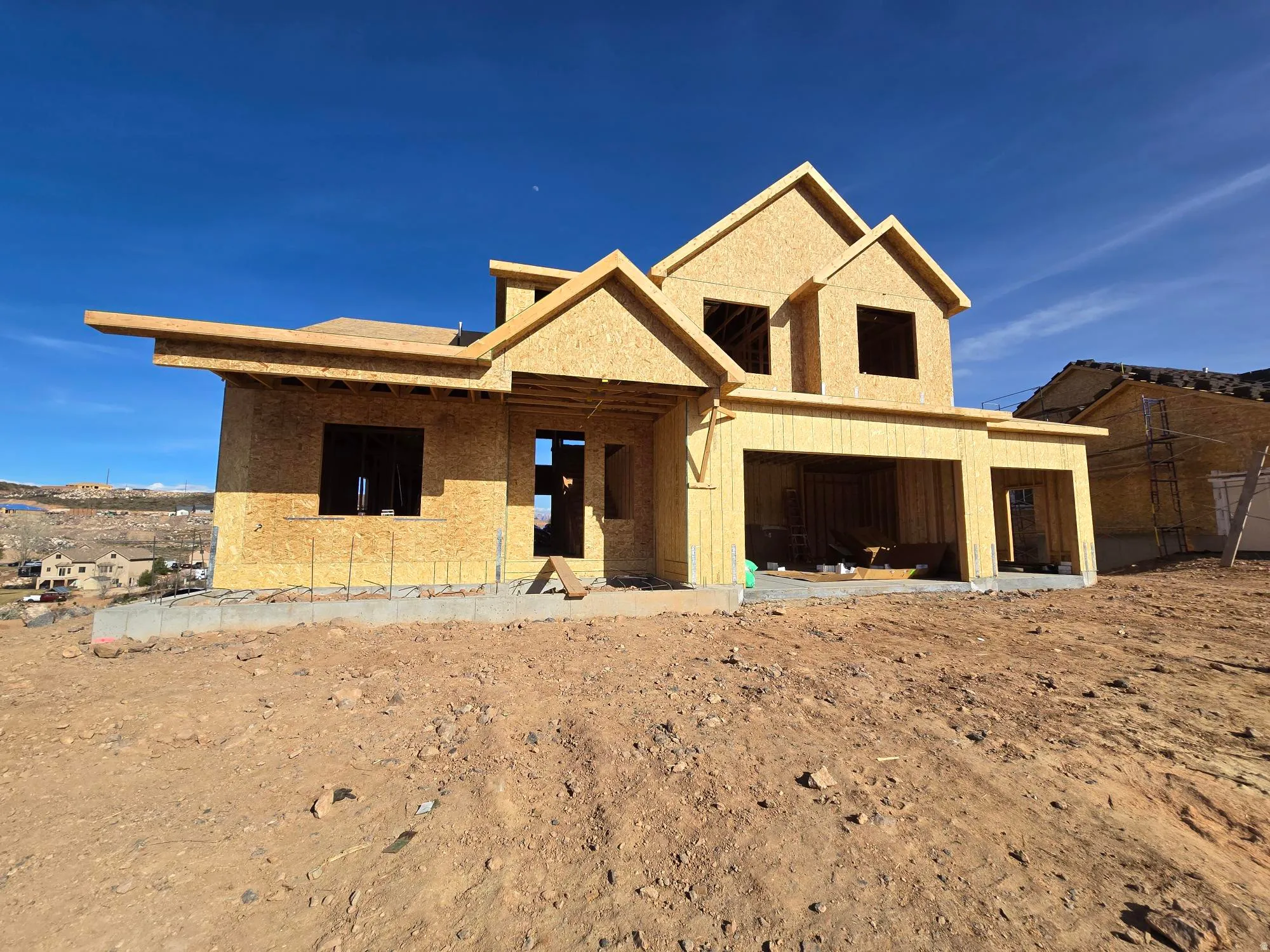 Property in mid-construction with stucco siding