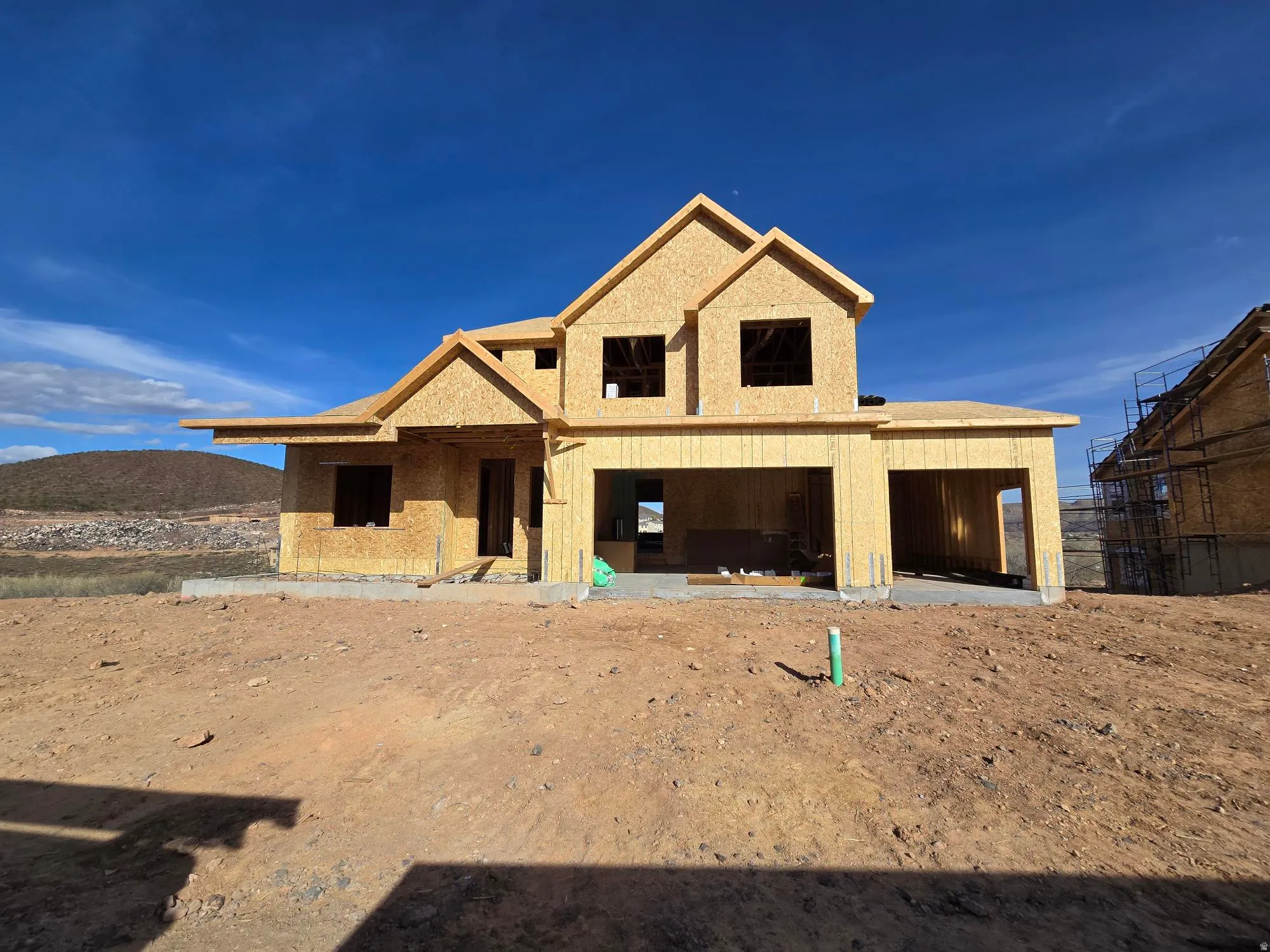 Unfinished property featuring a mountain view