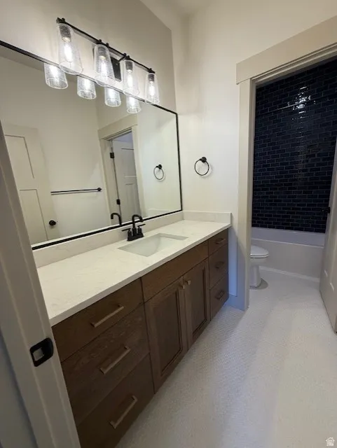 Full bath featuring vanity and bathtub / shower combination