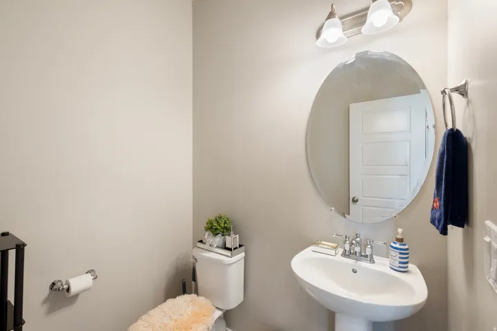 Half bathroom featuring toilet and a sink