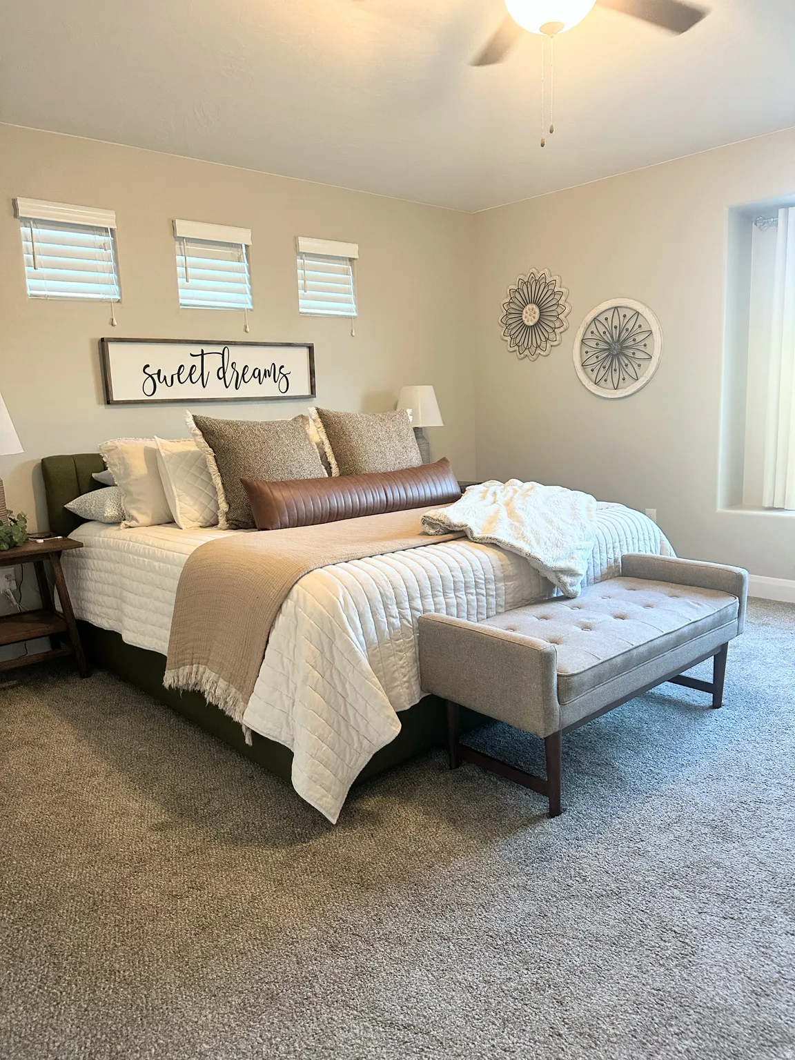 Carpeted bedroom with ceiling fan