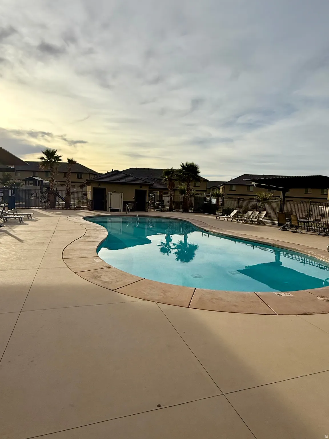 Community pool featuring a patio