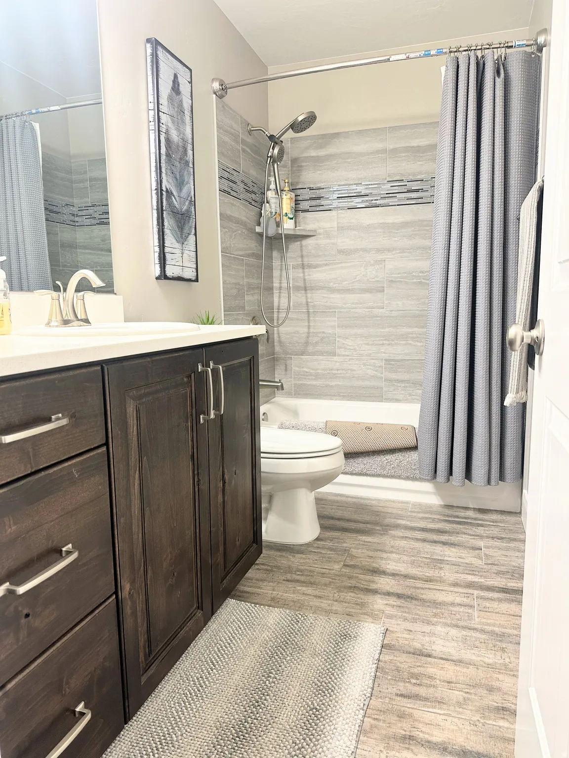 Bathroom featuring vanity and light wood finished floors
