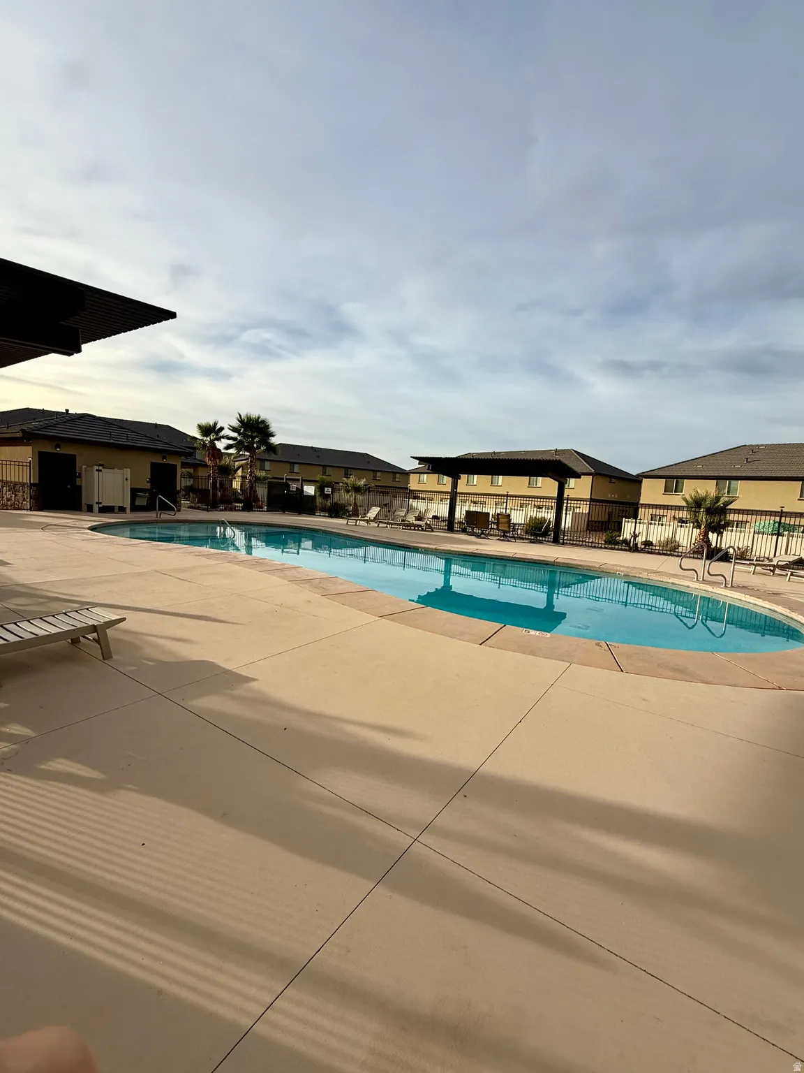 Community pool featuring a patio
