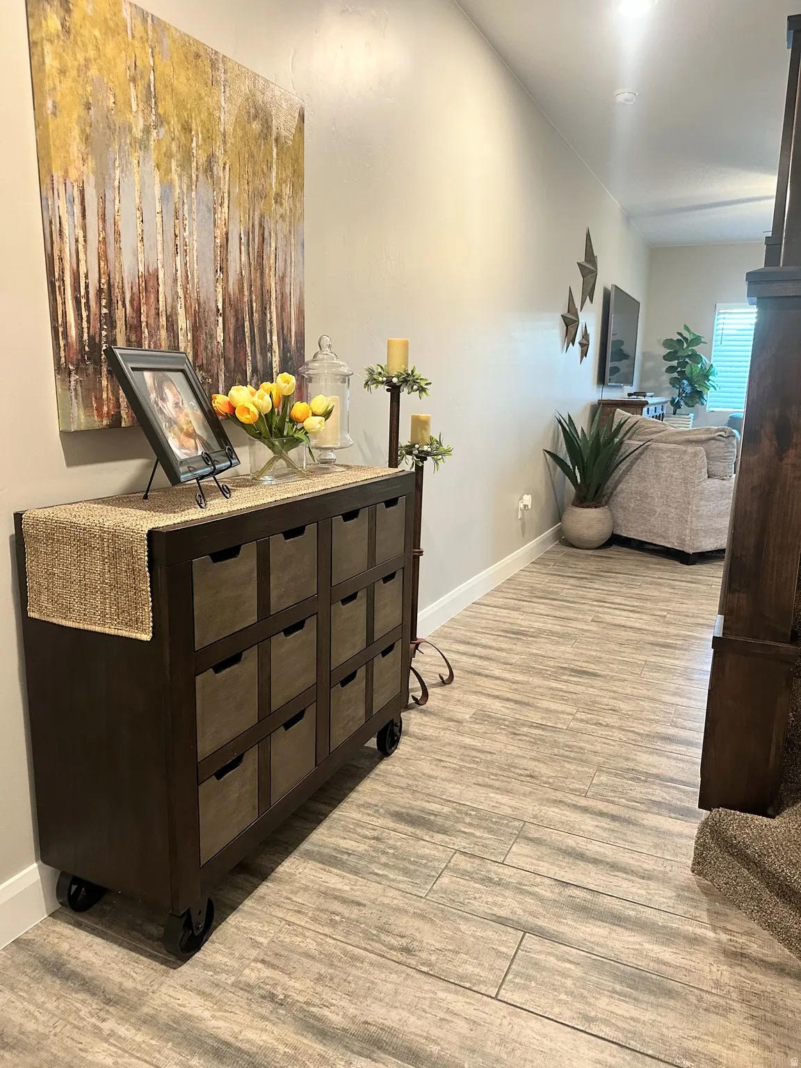 Hall featuring light wood-style flooring and baseboards