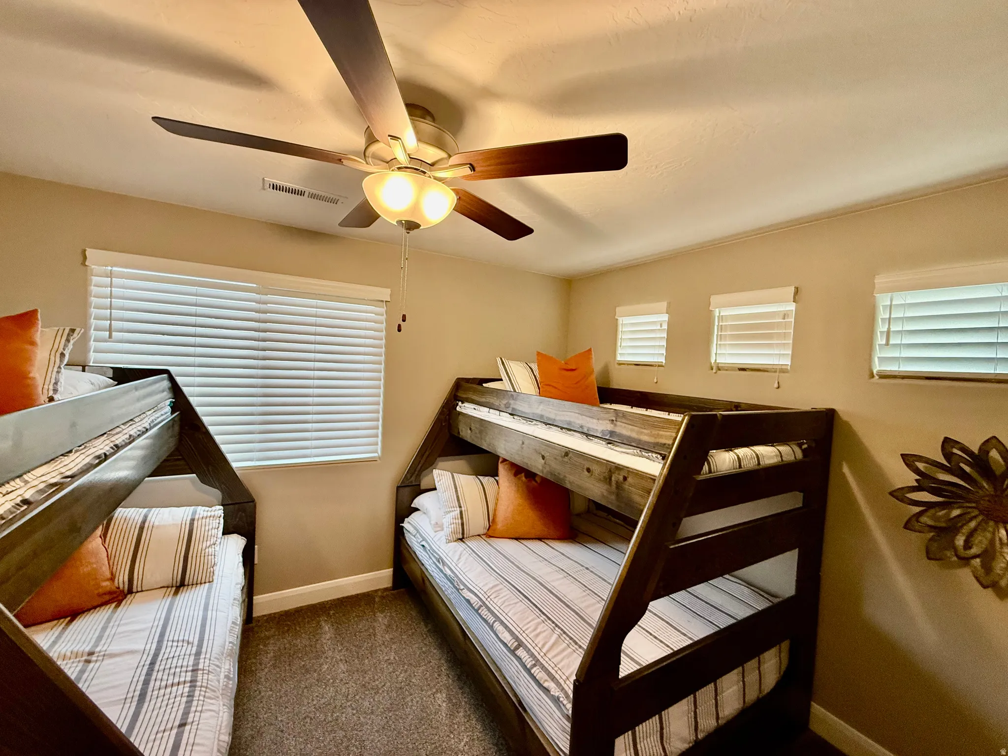 Carpeted bedroom with single over Double Bunkbeds, baseboards and ceiling fan