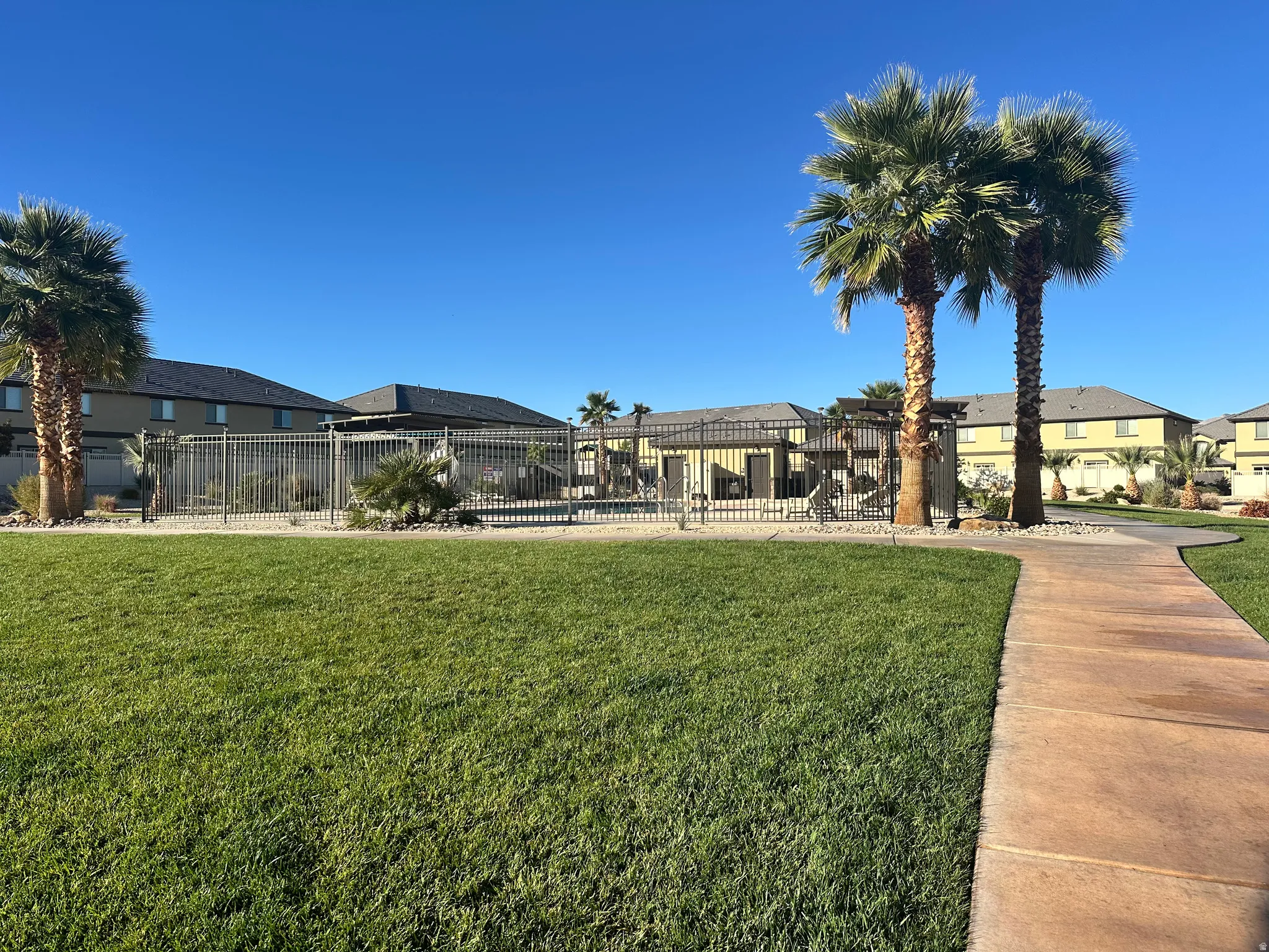 View of yard with a residential view and a pool