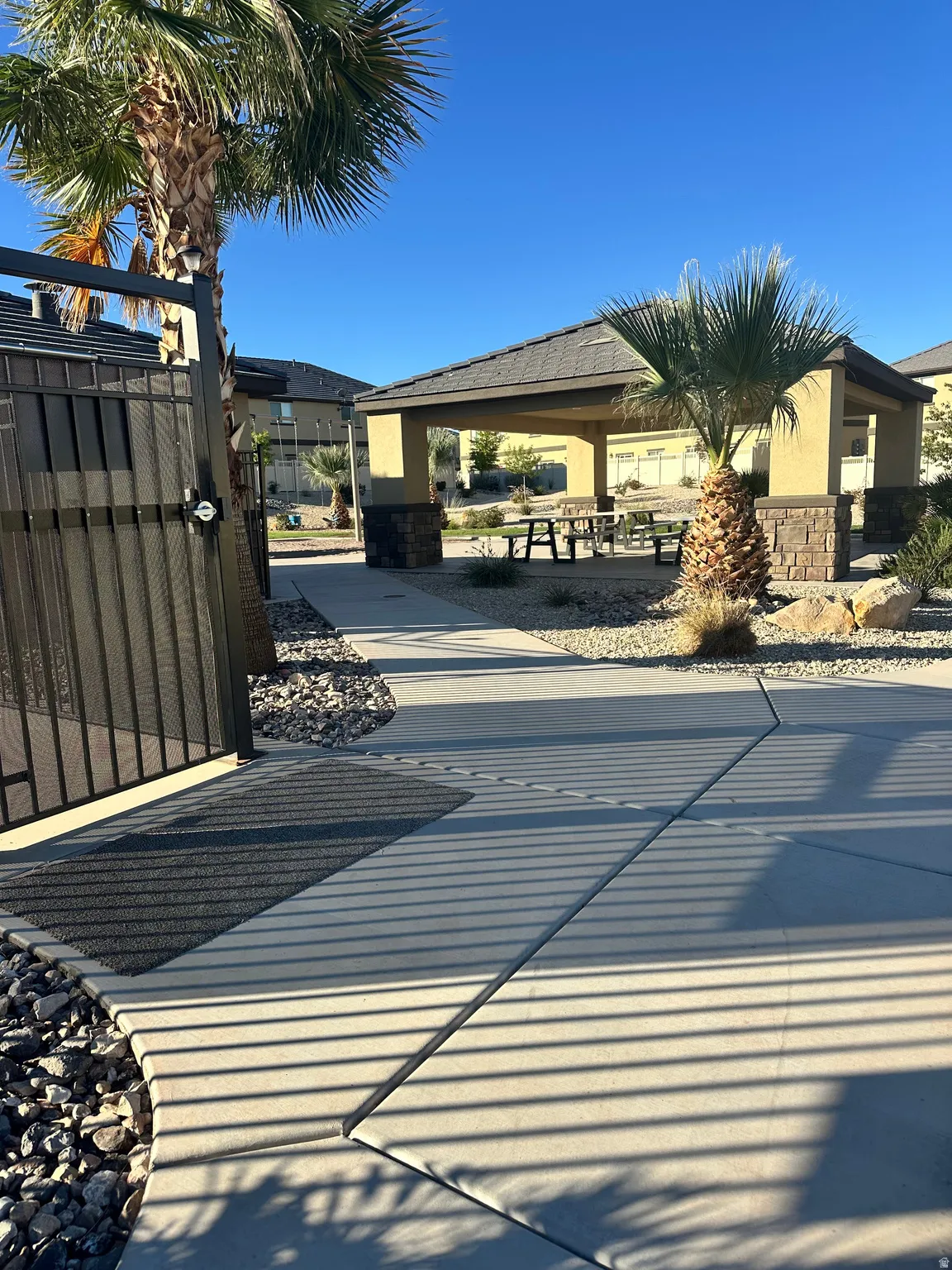 View of patio featuring a gate