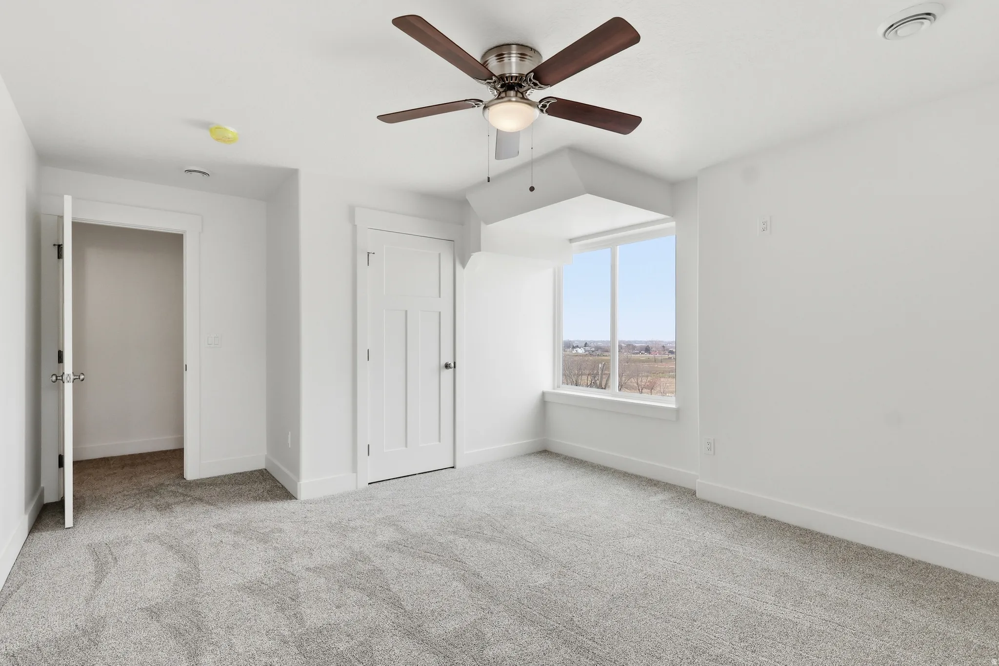 Bedroom featuring carpet and ceiling fan