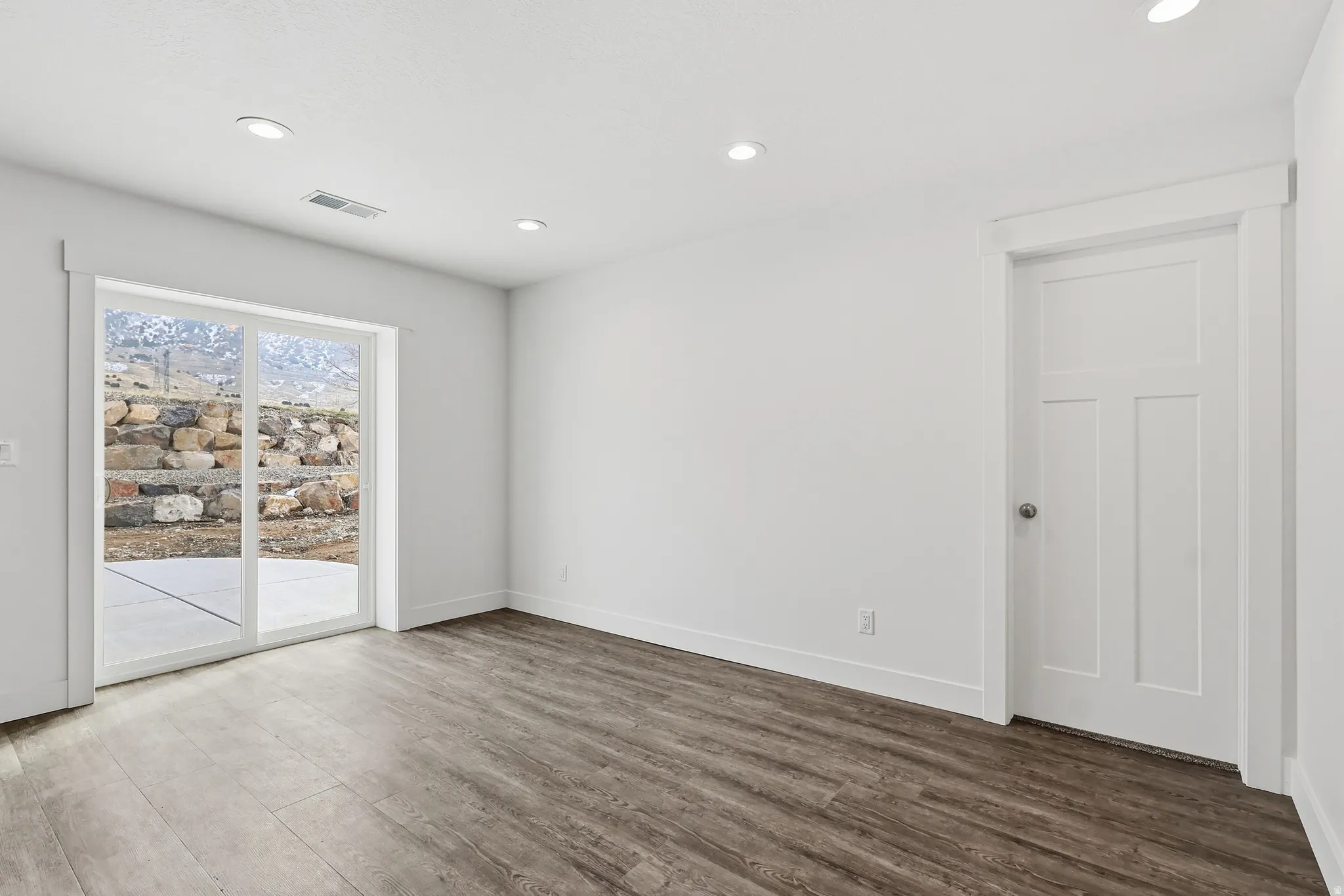 Dining area with doorway to back patio