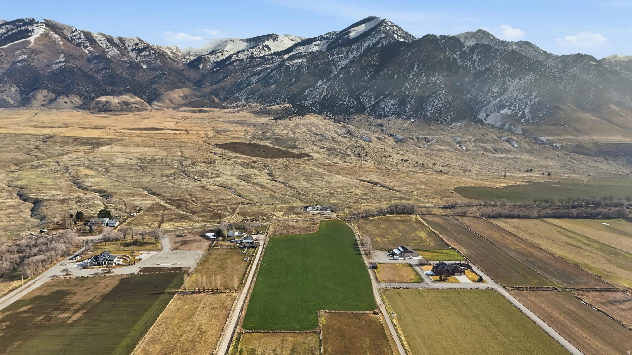 Overview of rural landscape with a mountain backdrop