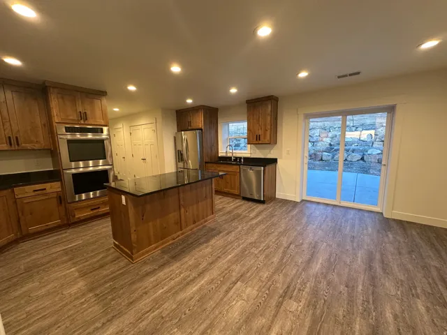 Kitchen and dining area with sliding door to back yard.